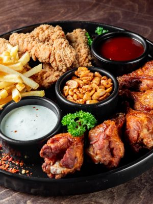 A,Platter,Of,Assorted,Fried,Foods,Including,Chicken,Wings,,French